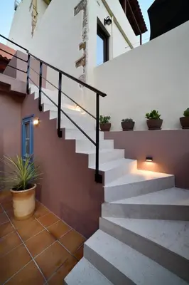a staircase in a house with potted plants at Casa Kâllisti Grande in Chania Town