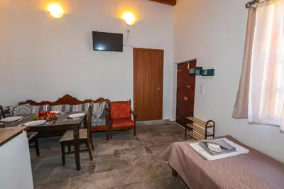 a living room with a table and a dining room at SternesVillage, Premium Balcony Suite in Stérnai