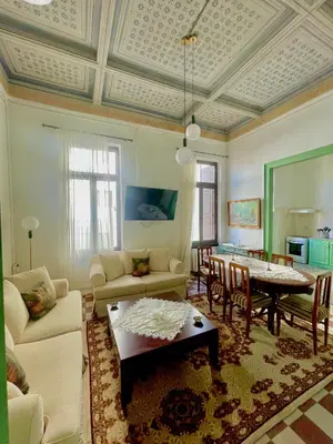 a living room with a couch and a table at La Sistina in Chania Town