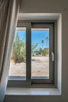a window in a room with a view of the desert at Vissalo Studios in Kissamos