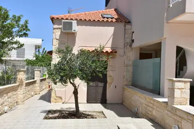 a tree in the courtyard of a house at Stefanie's House in Chania Town