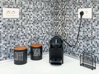 a bathroom with two trash cans and a heater at All Seasons Luxury Apartment in Chania Town