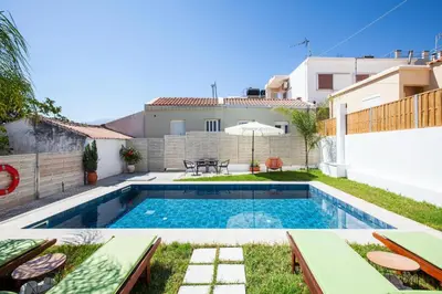 a swimming pool in the backyard of a house at Peponas Residence in Kato Daratso