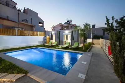 a swimming pool in the backyard of a house at Peponas Residence in Kato Daratso