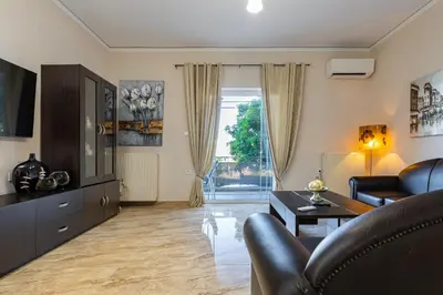 a living room with a couch and a table at Blissful Residence with Pool by 8essentially in Daratso