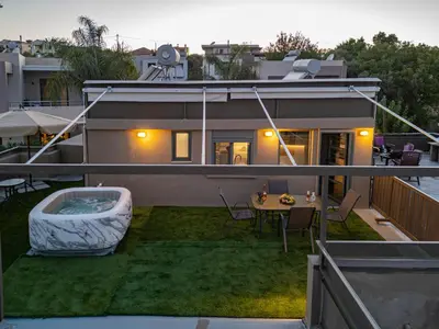a house with a yard with a tub on the roof at Panorama View Apt with Jacuzzi by 8essentially in Daratso