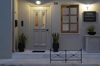 a front door of a house with potted plants at Porta Harenae Residencia in Chania Town