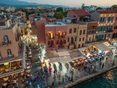 an overhead view of a city with a crowd of people at Leo Apartment 2 bdr apt overlooking the harbor in Chania Town