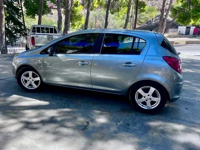 a small silver car parked in a parking lot at Villa Cicada Chania, steps from the beach, Car included in Agia Marina Nea Kydonias