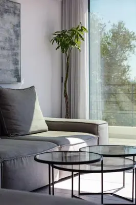 a living room with a couch and a table at Ikon Living Chania in Chania Town