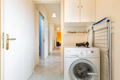 a laundry room with a washing machine and a hallway at Large Cozy House near the sea - Kolimvari Village - 6 Pax in Kolymvari