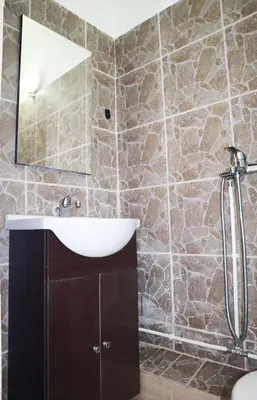a bathroom with a sink and a mirror at Studio92 Chania in Chania Town