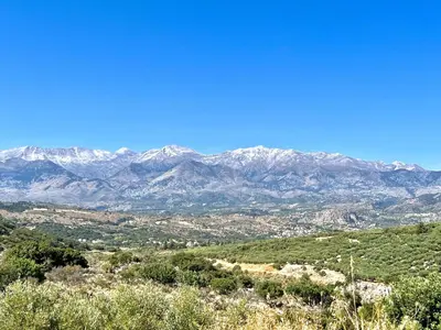 a view of a mountain range with snow covered mountains at Villa Amvrosia Nr Kalives Crete in Arménoi