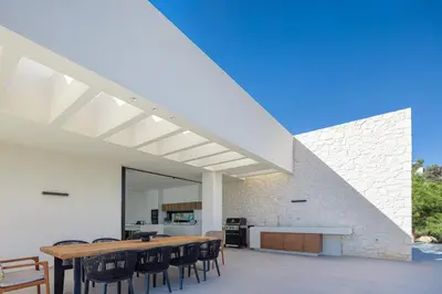 a kitchen and dining room with a table and chairs at Avery Villa in Chania Town