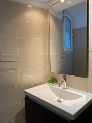 a bathroom with a sink and a mirror at Be Crete - Zen Appartments 1 room in Agia Marina Nea Kydonias