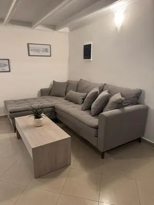 a living room with a couch and a coffee table at Foumidon Apartments, Chania in Chania Town