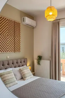 a bedroom with a large bed and a window at Armeria Apartments I I in Daratso
