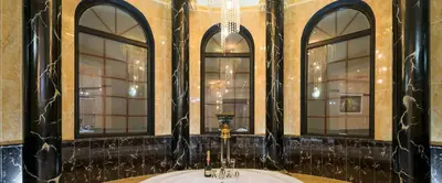 a bathroom with a sink and three windows at Pandis Palace in Agios Onoufrios