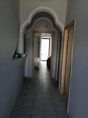 a hallway leading to a bedroom with an archway at Ελευθέριος rooms 2 in Chania Town
