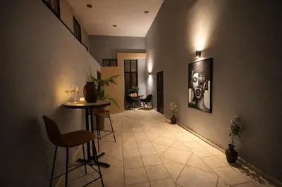a hallway with a table and chairs in a building at Endless blue suites 3 in Chania Town