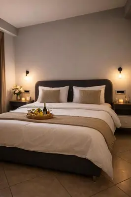 a bedroom with a large bed with a tray of fruit on it at Endless blue suites 4 in Chania Town