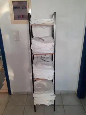 a rack filled with white towels in a refrigerator at Erofili Apartment in Kalyves