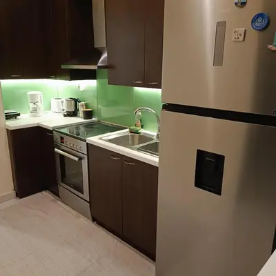 a kitchen with a refrigerator and a sink at Drosoula house in Chania Town