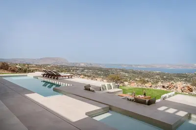 a swimming pool with a view of the ocean at JK's 4 in Vamos