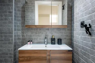 a bathroom with a sink and a mirror at Hypnos Luxury Lodgings in Chania Town