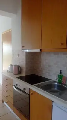 a kitchen with a sink and a counter top at QUIET NEW Apartment-5' to the beach, 15' to center in Chania Town