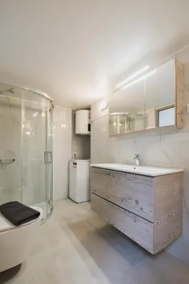 a bathroom with a sink and a shower and a tub at Peris 4 with Yard steps to Old Town - AC, Wifi in Chania Town