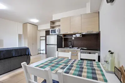a kitchen and dining room with a table and chairs at Dimi's Studio Center in Chania in Chania Town
