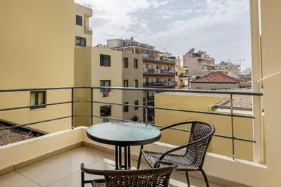 a balcony with a table and chairs and a view at Dimi's Studio Center in Chania in Chania Town