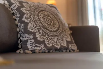 a pillow sitting on top of a couch at Almyrida Bay View House III BY APOKORONAS-VILLAS in Almirida