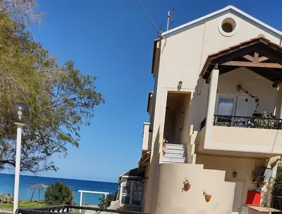 a white house with a view of the ocean at Sky & Sea 3 in Kato Daratso