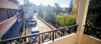 a balcony of a building with a view of a street at Sky & Sea 3 in Kato Daratso