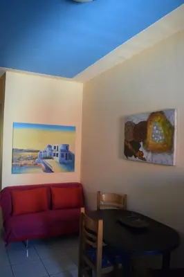 a living room with a couch and a table at Alena Apartments in Chania Town