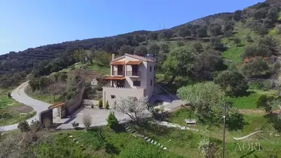 an aerial view of a house on a hill at Aori Hillside Villa in Kántanos