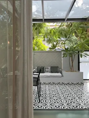 a living room with a couch and a table at Ethyr Atrium in Chania Town