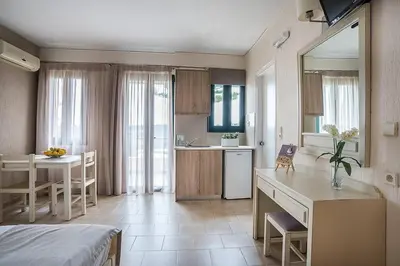 a room with a kitchen and a dining room at Rainbow Hotel Apartments in Chania Town
