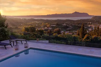 a swimming pool with a view of a city at Villa Anthos - Superb panoramic sea and hill views with private pool in Gavalochori
