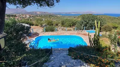 a person in a boat in a swimming pool at Villa Oneiro Tsivaras in Tsivarás