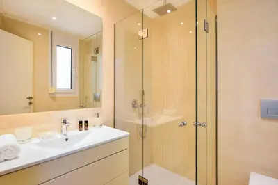 a bathroom with a sink and a shower at Villa Melitini in Souda