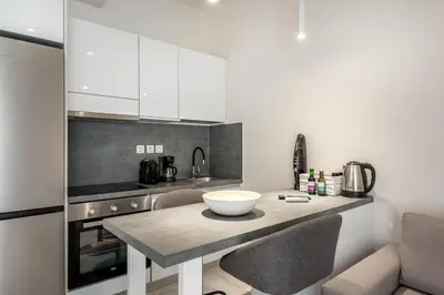 a kitchen with a table with a bowl on it at Harma City Living in Chania Town