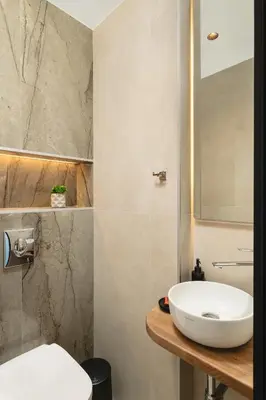a bathroom with a sink and a mirror at Lovelia Luxury Apartment Chania EV Car Wallbox in Chania Town