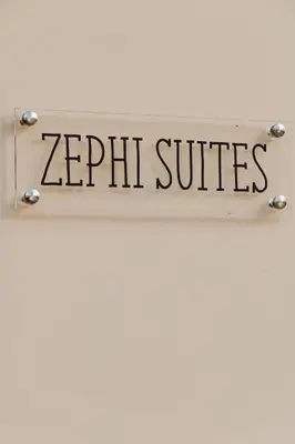 a sign that reads zhp suites hanging on a wall at Dreamscape Residences - Zephi Suite in Chania Town
