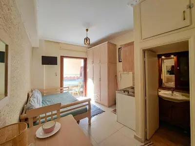 a room with a kitchen and a dining room at Center studio 25 in Chania Town