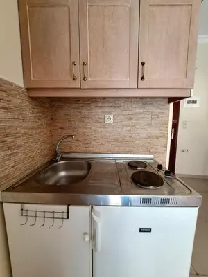 a kitchen with a sink and a counter top at Center studio 25 in Chania Town