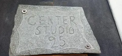 a stone sign that says career study is on a table at Center studio 25 in Chania Town