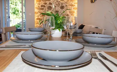 a table with plates and bowls on top of it at Casa di Mina's in Chania in Sirílion